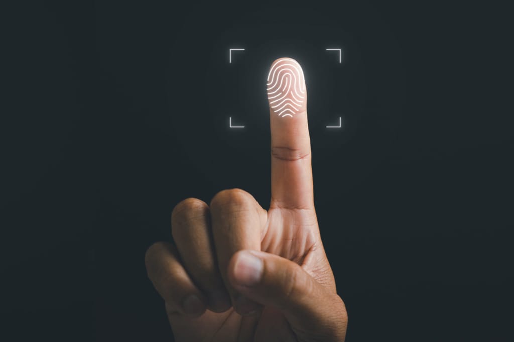 An image of a fingerprint being scanned to symbolize employee monitoring data protection.