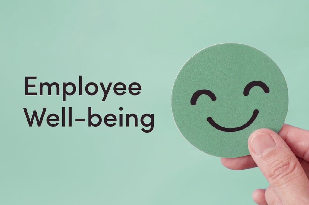 A coaster with a smiley face on it with the words employee wellbeing