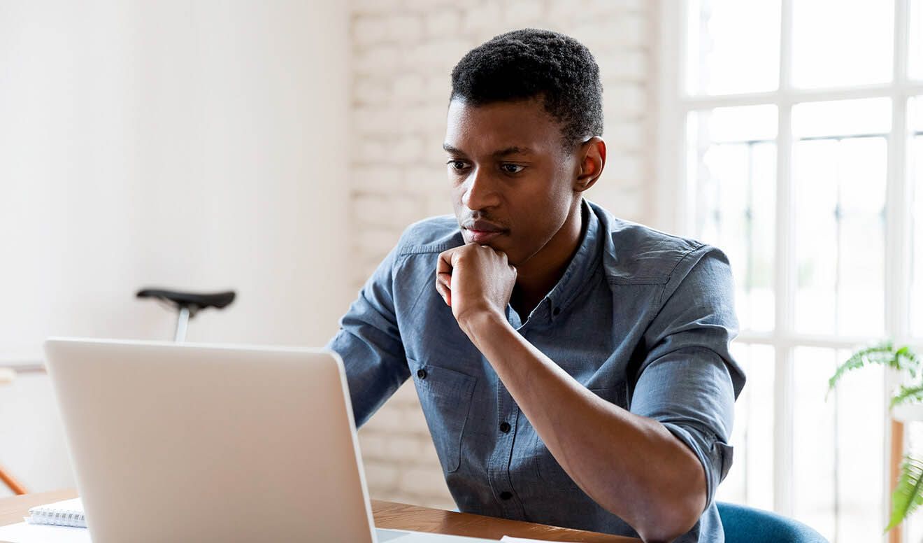 Man sitting at a desk configuring ActivTrak.