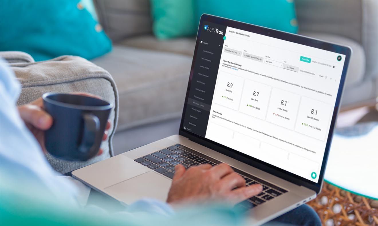 A manager reviewing ActivTrak’s Benchmarks and goals report to assess their team’s productivity.