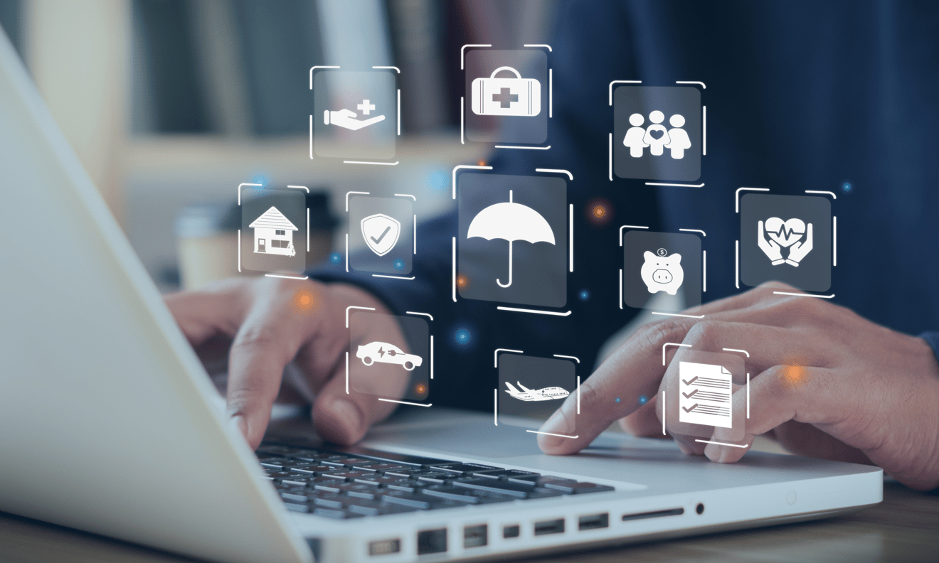 an image of a person using a computer with icons signaling different insurance options.