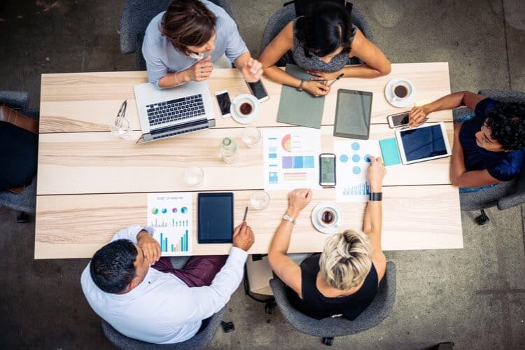 A group of employees collaborating and being productive in the workplace.