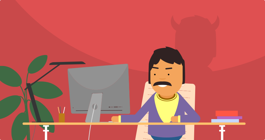 A malicious insider threat working at his desk