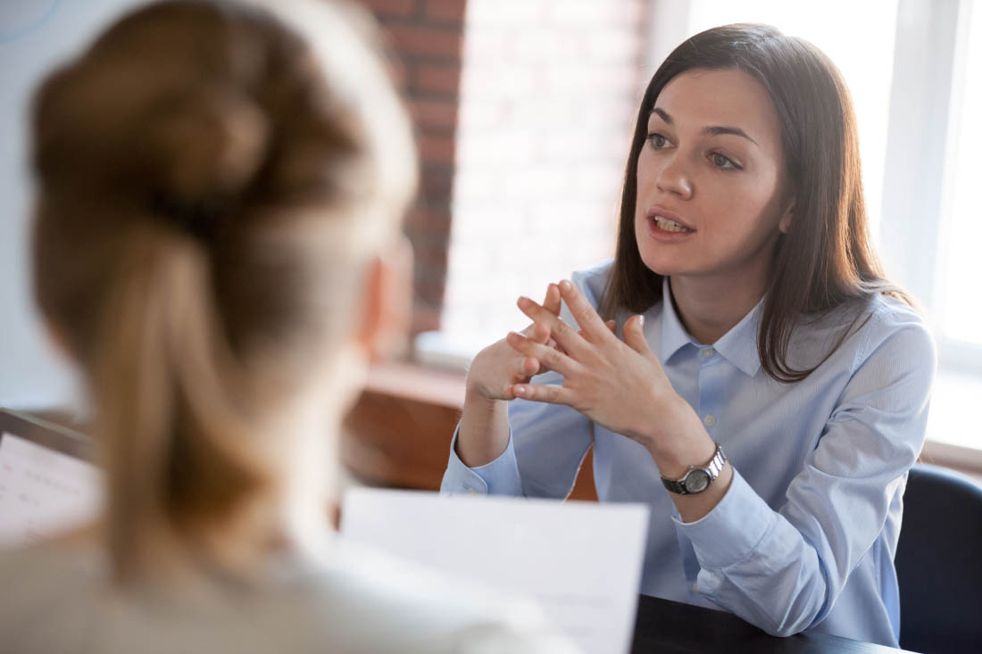 A Manager coaching employees for improved performance.