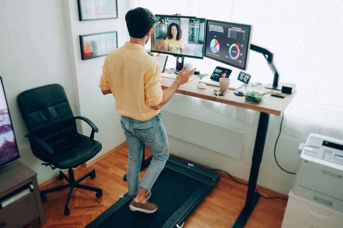 An employee in a home office to show the potential difference between remote vs work from home.