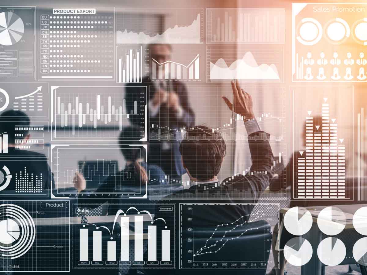 Business team analyzing interactive data dashboards during a meeting.